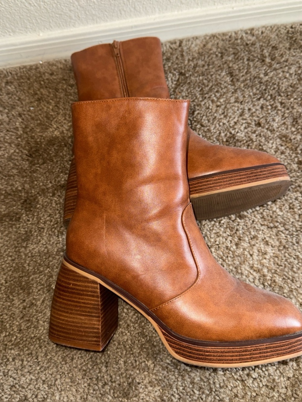 Women’s tan wedge boots. Size 9 1/2.